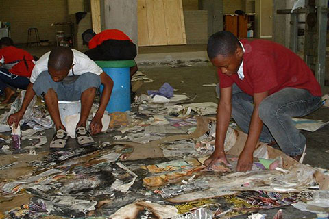 People clean up after a fire