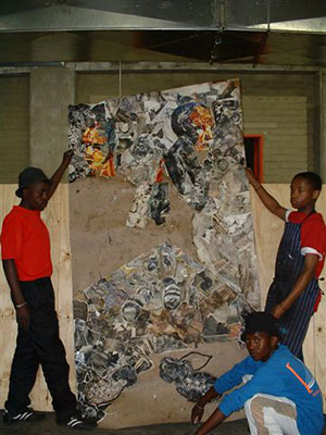 People hold up a large poster
