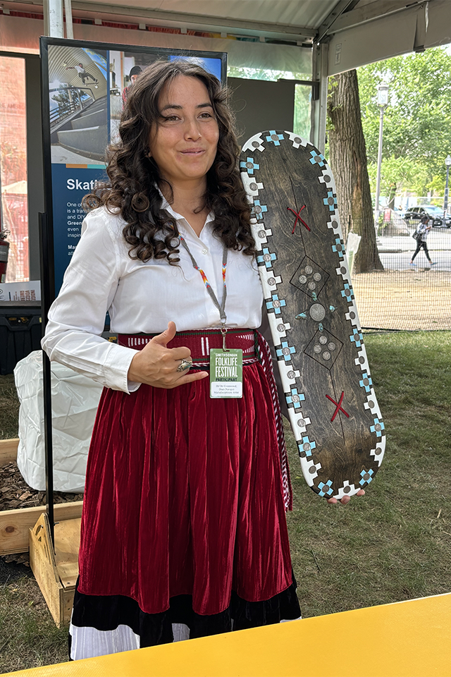 Indigenous skateboarder, skateboard maker, and shoe designer Di'orr Greenwood (Diné/Navajo) at the 2024 Smithsonian Folklife Festival