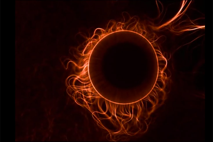 Orange microtubules oscillating against a black background