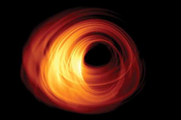 Black hole in orange against a black night sky