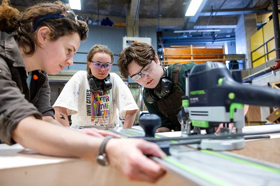Students in a workshop constructing a theatrical set