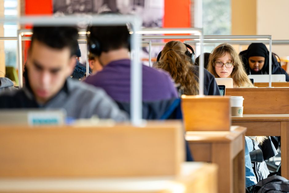student studying in library during finals