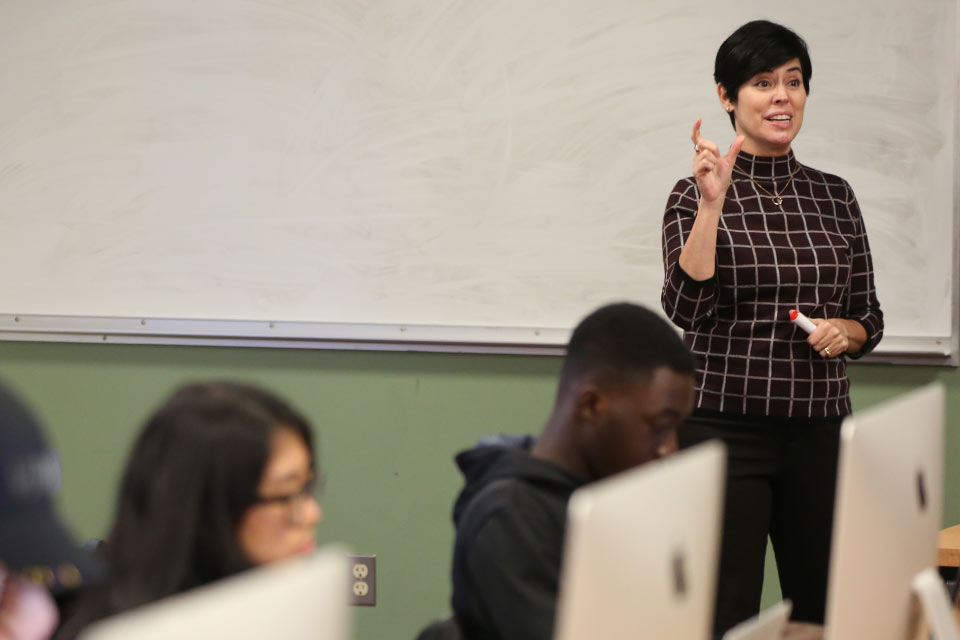 Theresa Mitchell instructing students in a computer lab