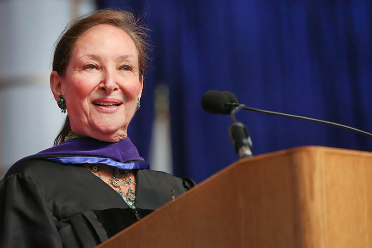 Canadian Supreme Court Justice Rosalie Abella stands before an applauding crowd following her Commencement address.