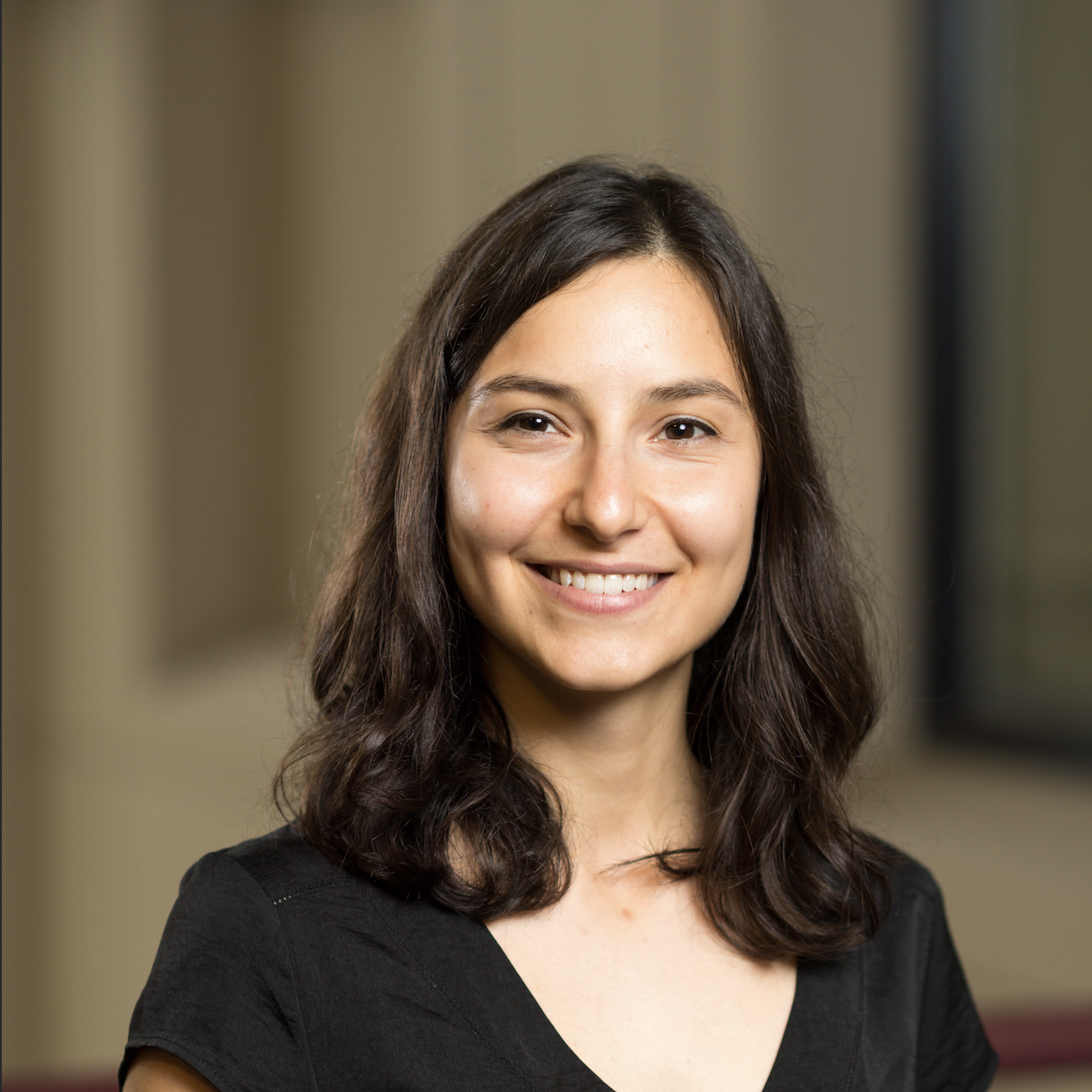 headshot of girl with dark hair, light skin, and black shirt