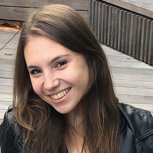 a picture of a young woman with brown hair smiling