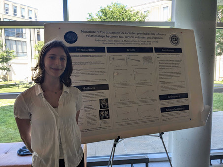 Katherine standing in front of her poster