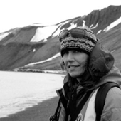 Author outside near snow-topped mountain