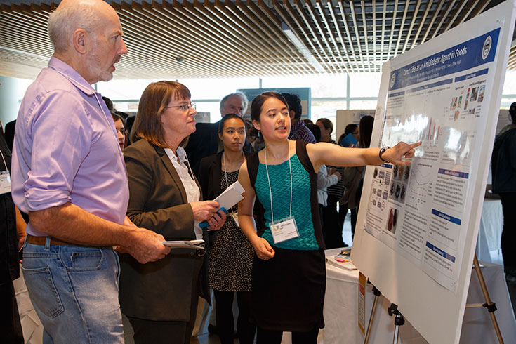 student presenting research on carrot fiber