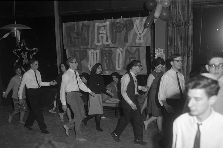 Black and white photo of people celebrating Purim