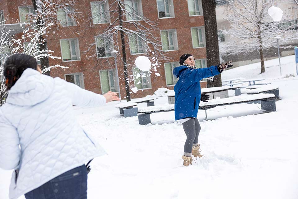 Color photo of students having fun in the snow
