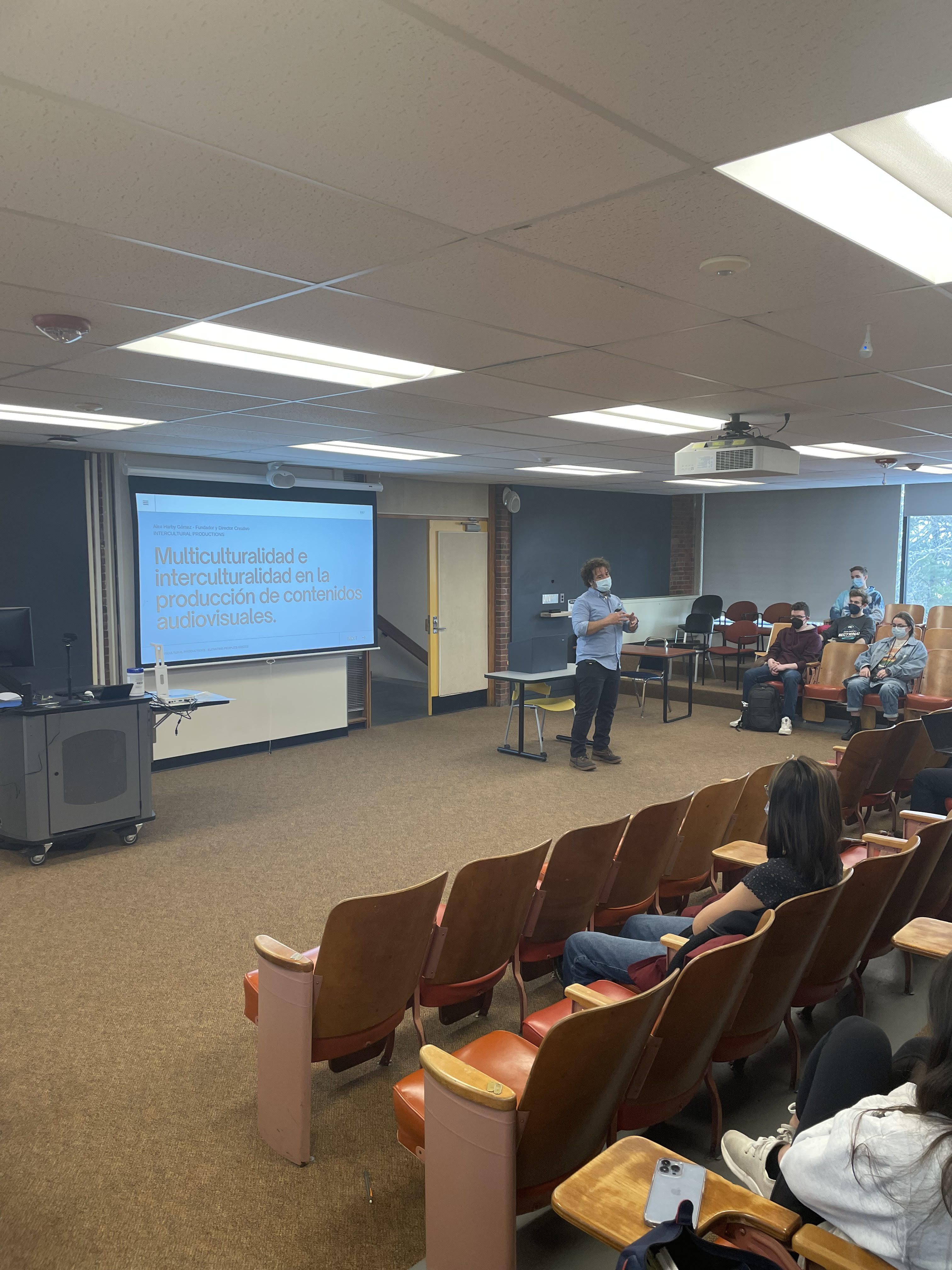 Alex Gomex presenting in large lecture classroom for the recent event
