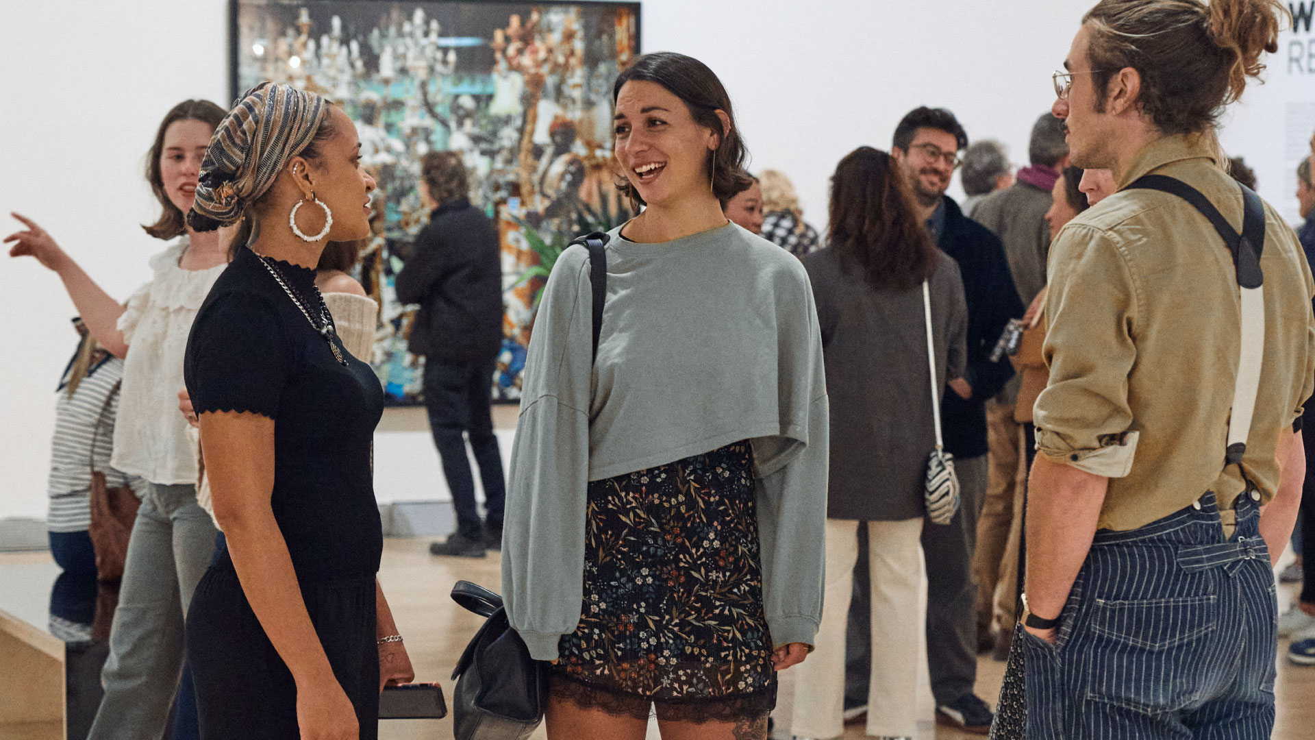 People gathering at an opening reception at the Rose Art Museum