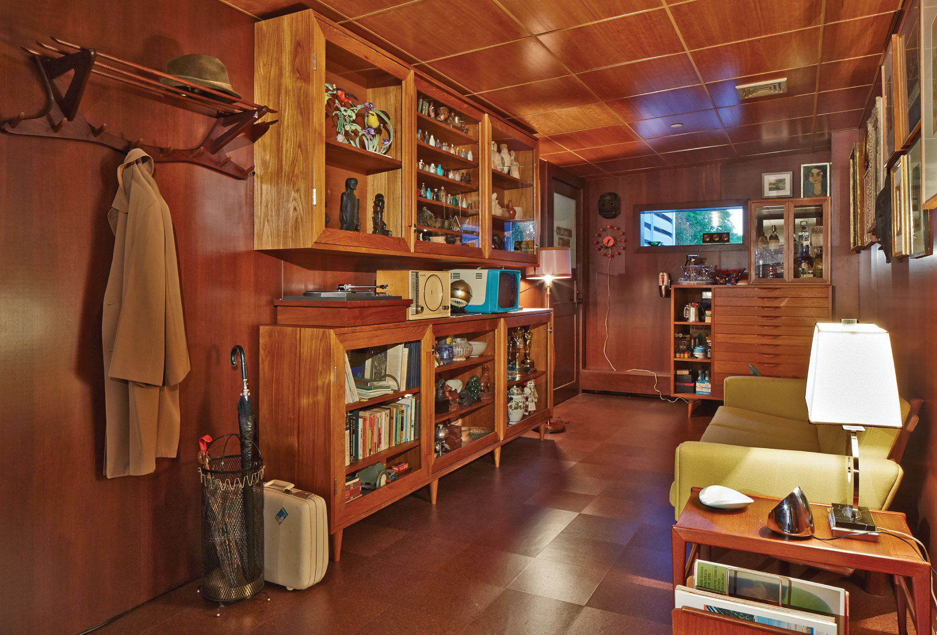 Wood-paneled room with a yellow couch.