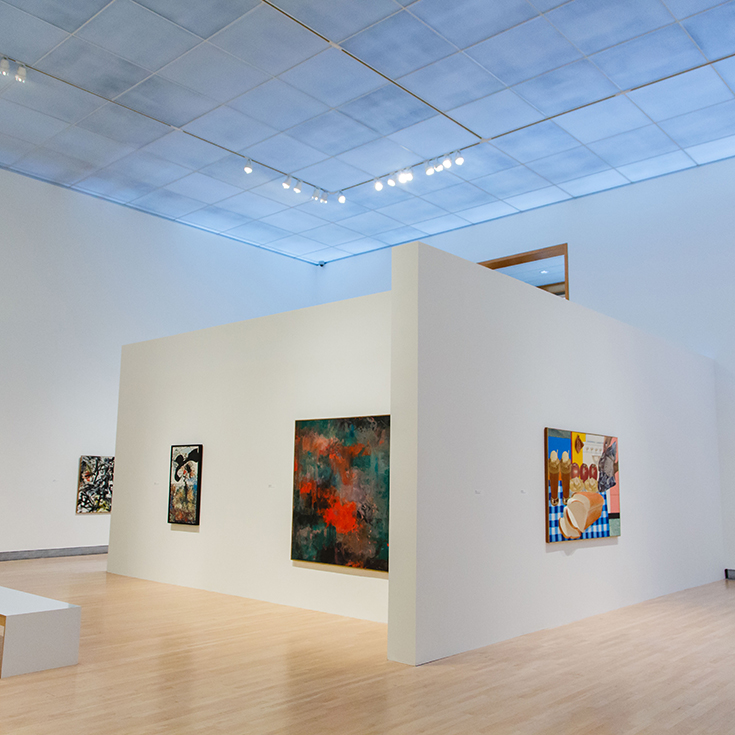 An installation view of Rose Art Museum exhibition Passage with four works of art hung on white walls of the gallery. 