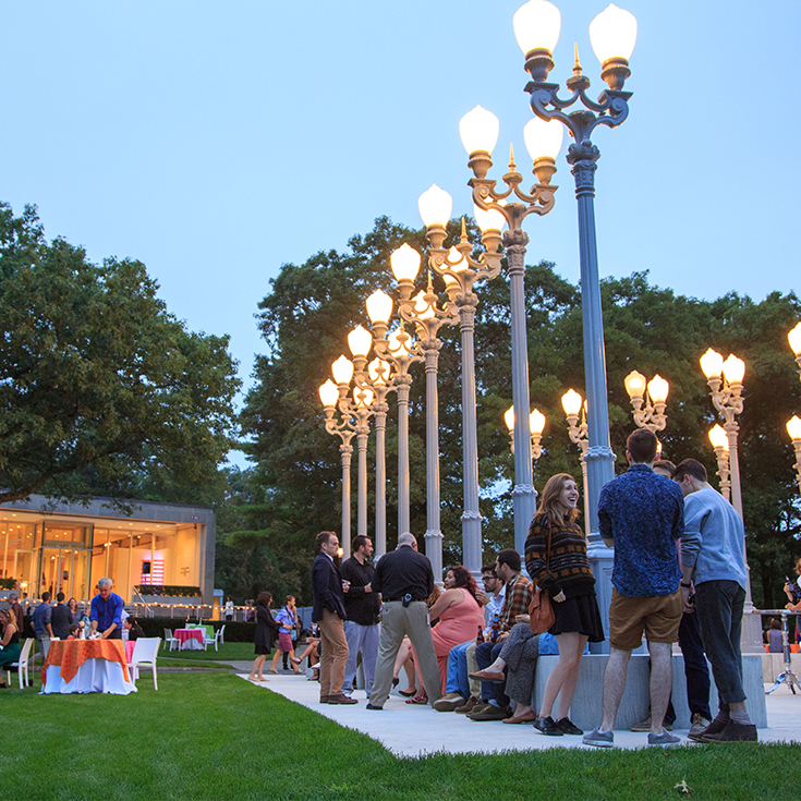 People gather in front of the museum to celebrate the opening of exhibitions