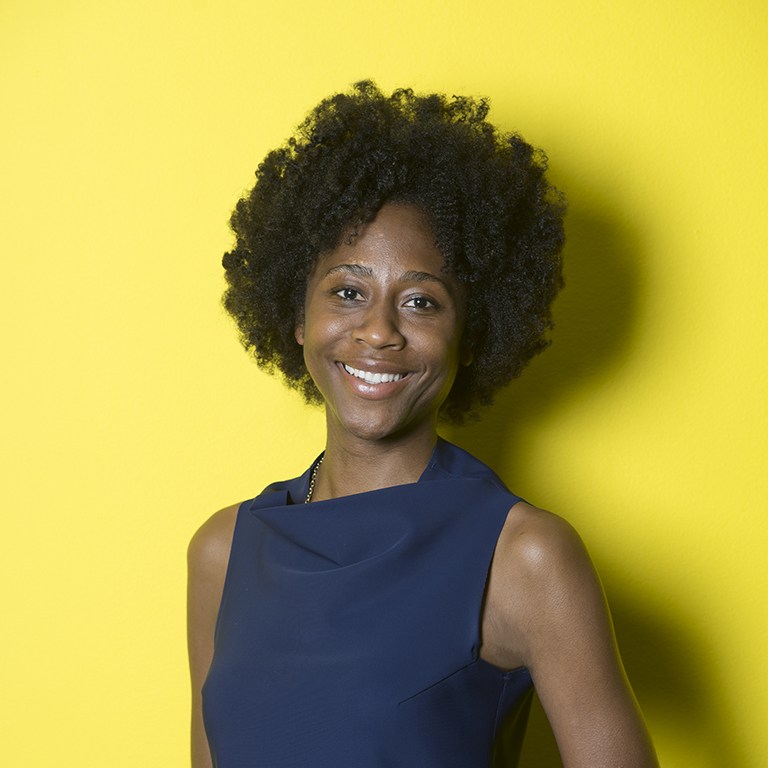 headshot of curator Naomi Beckwith with yellow background 