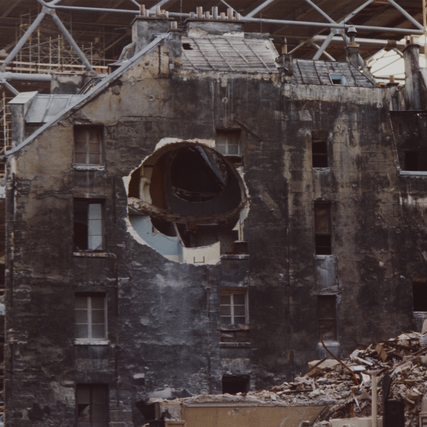 Large hole carved in the side of building. 