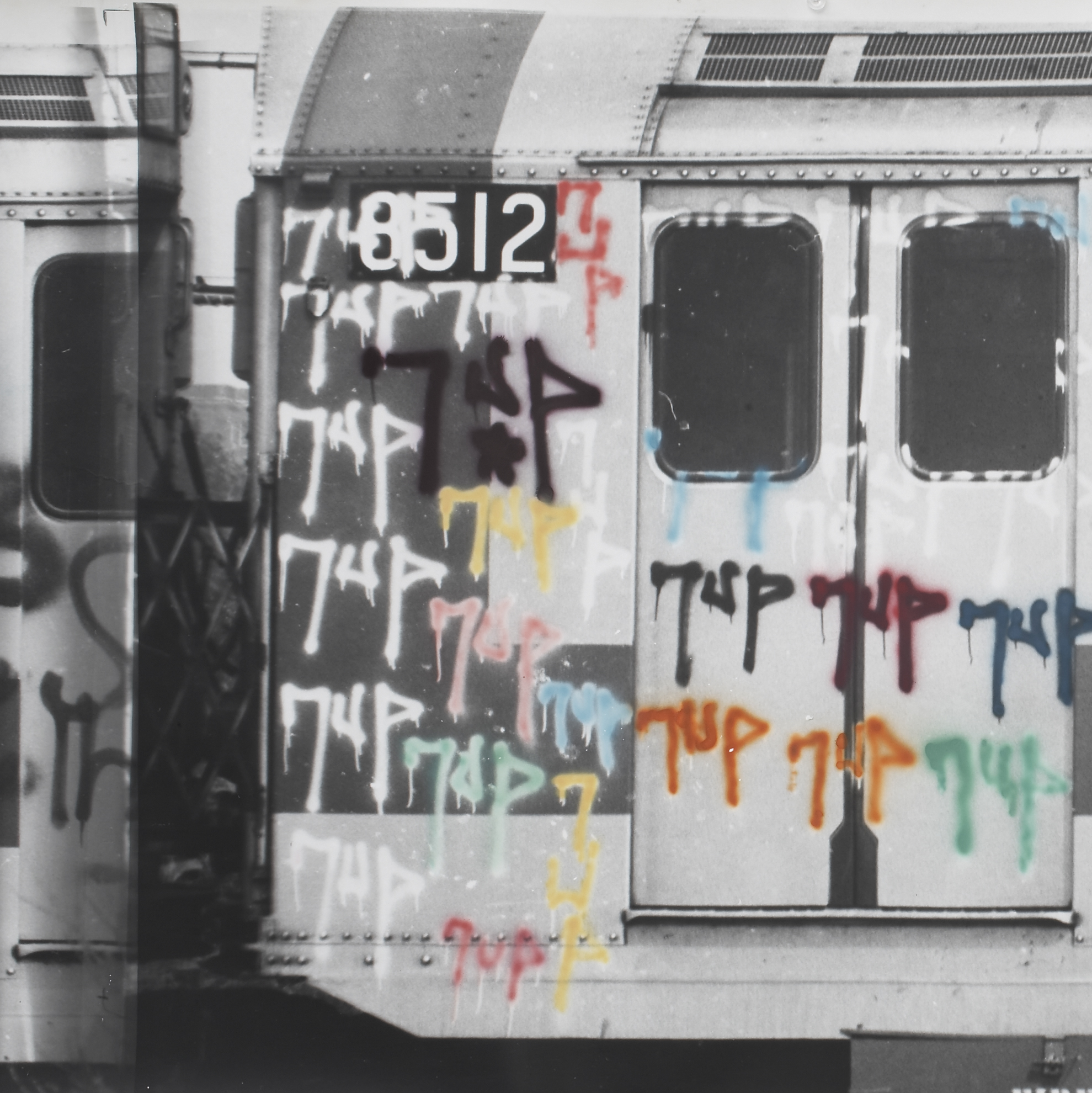 Train car covered in colorful graffiti