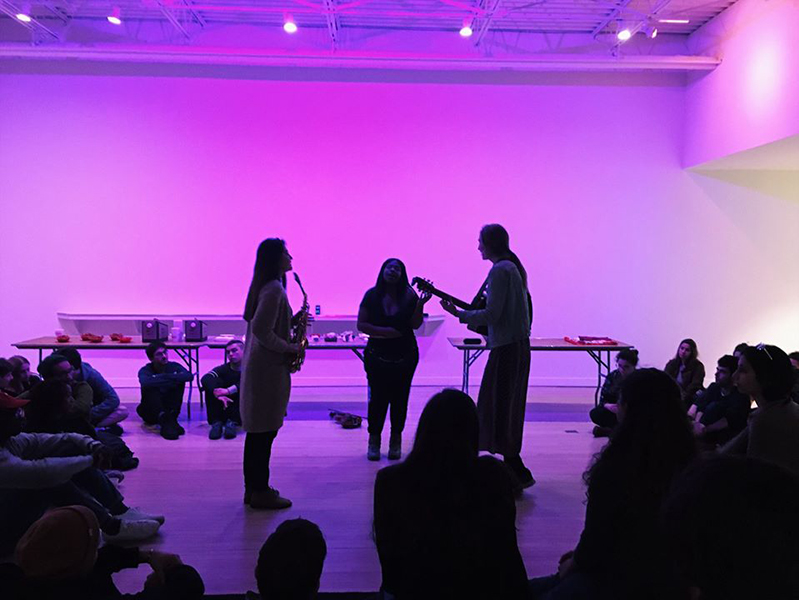 People played instruments bathed in purple light. 