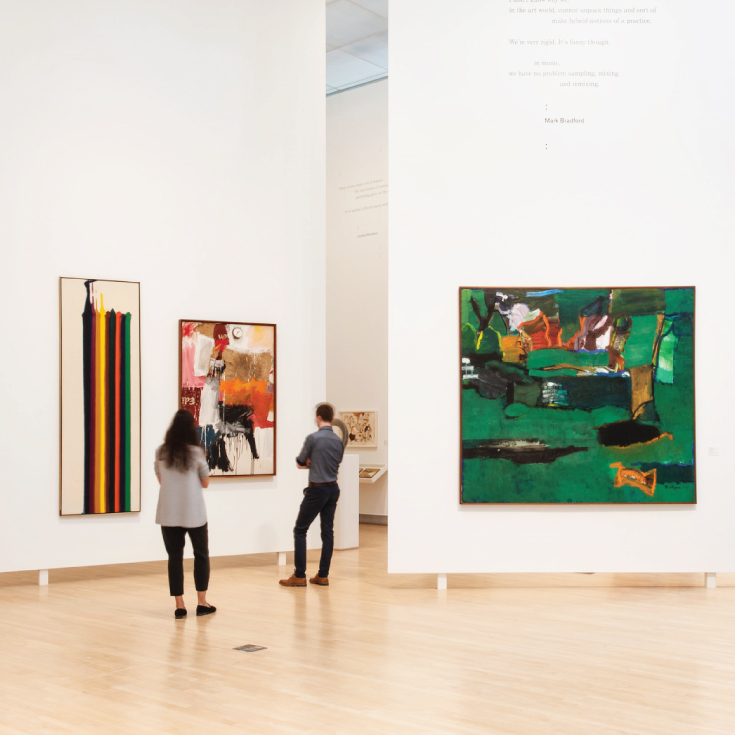 Two people looking at art in the Lois Foster Wing of the Rose Art Museum