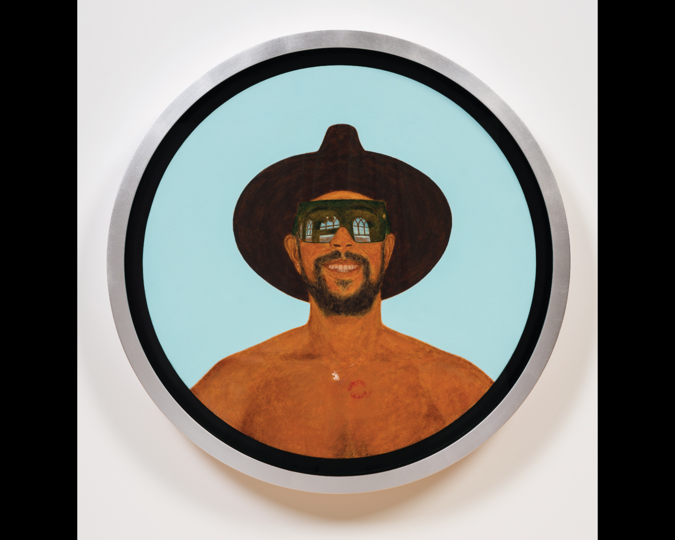 Circular self-portrait of Barkley L. Hendricks wearing sunglasses, a black hat, and a chain with a palette around his neck, with a blue background