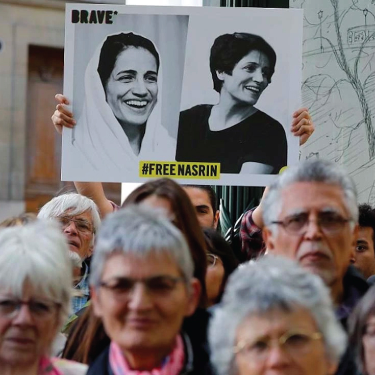 Protestors holding up a sign saying Free Nasrin