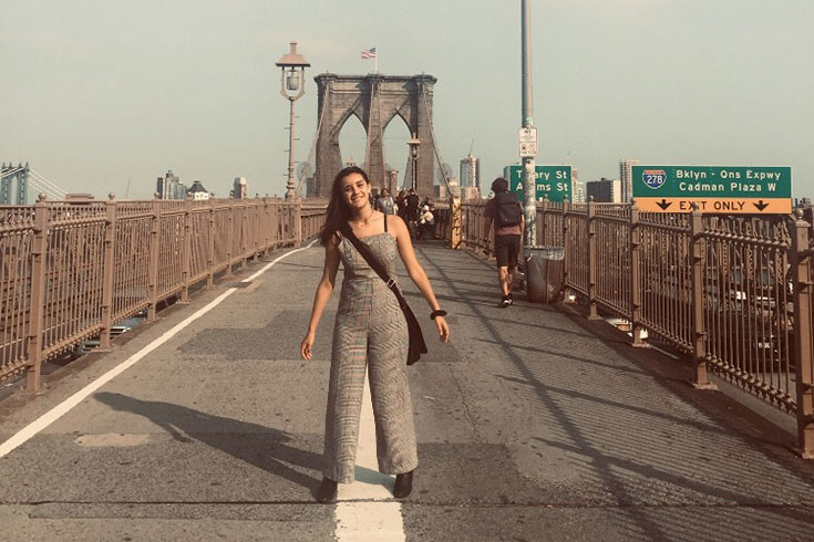Alison Hagani stands on a New York bridge
