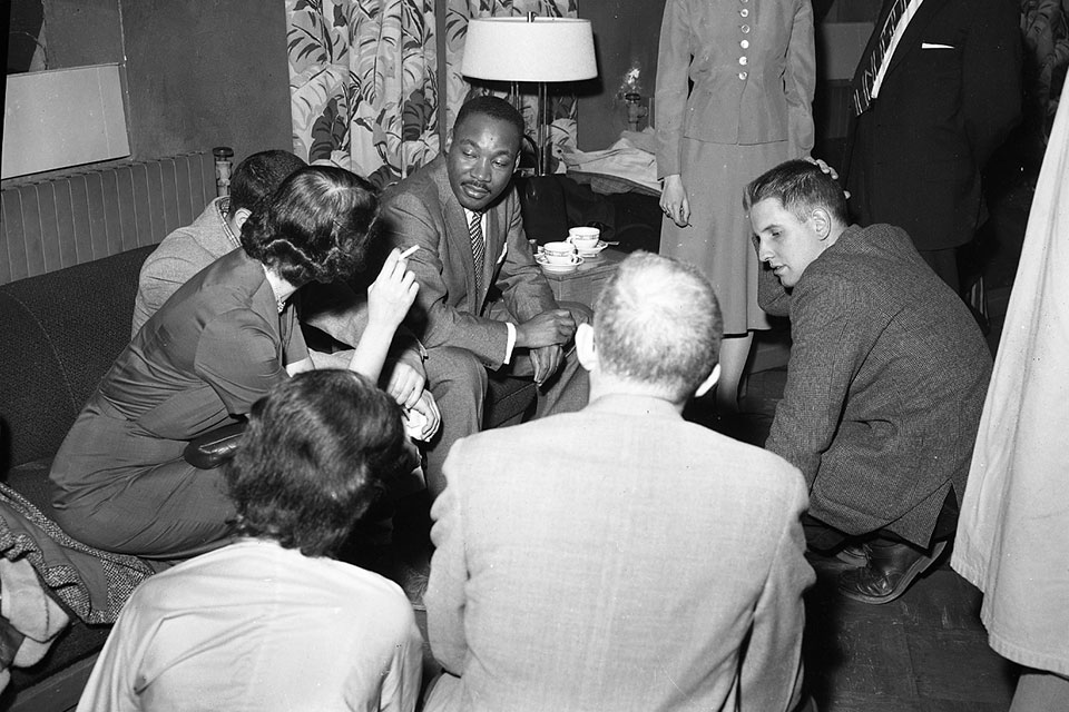 Martin Luther King Jr. sits and talks with Brandeis students in 1957