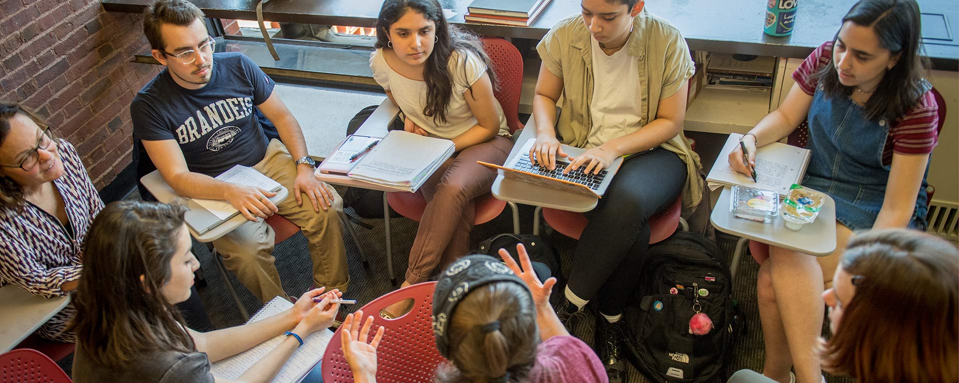 A circle of students having an animated discussion