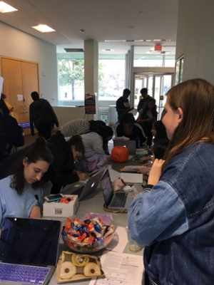 Crowded table of students registering to vote