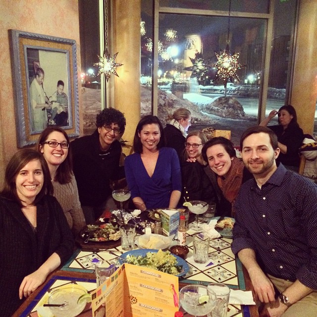 Grad students enjoy a dinner at a restaurant