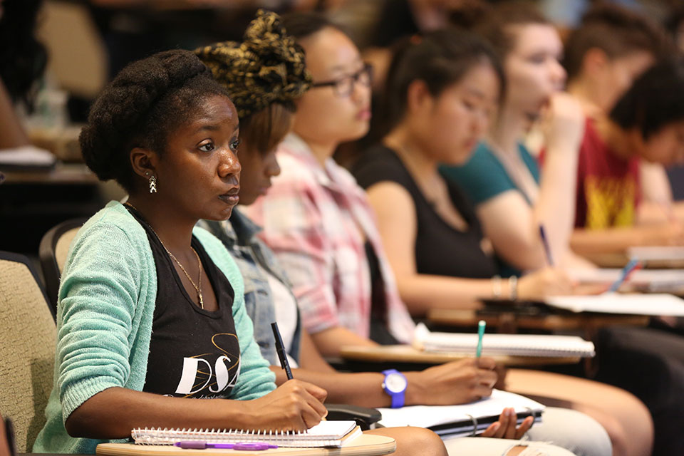 Students attentively taking notes