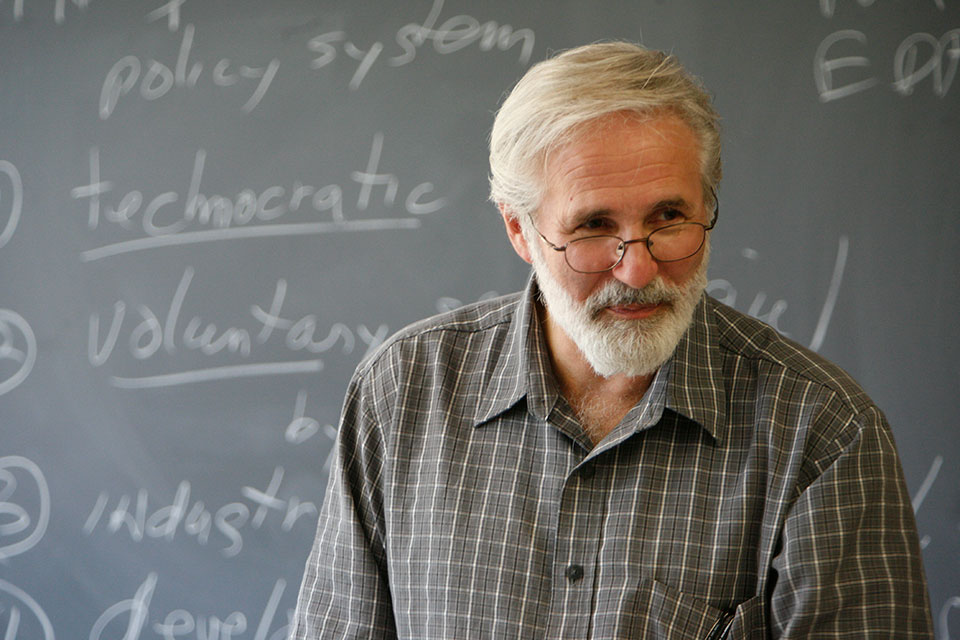 Carmen Sirianni teaching at a blackboard