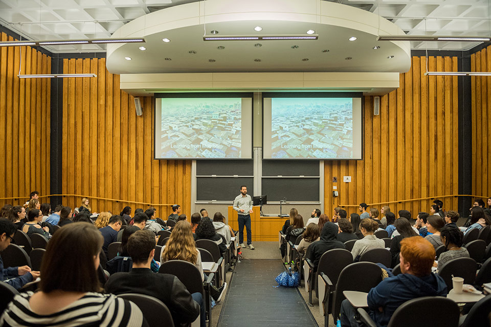 Professor Anjaria giving a lecture to a full class of students