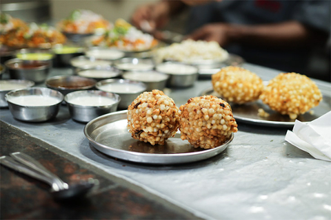 Balls of food and sauce on a table