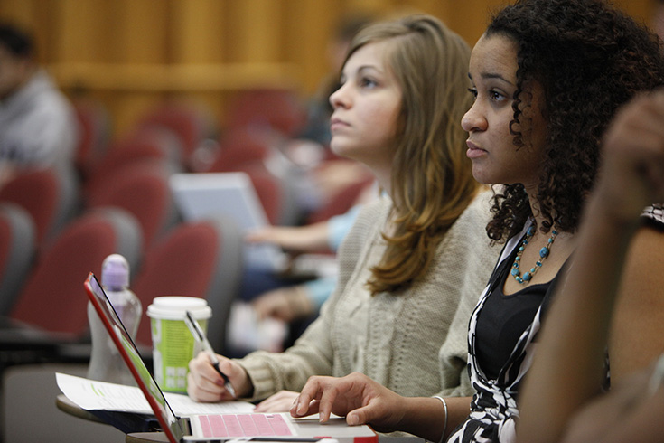 Two students at their desk in class