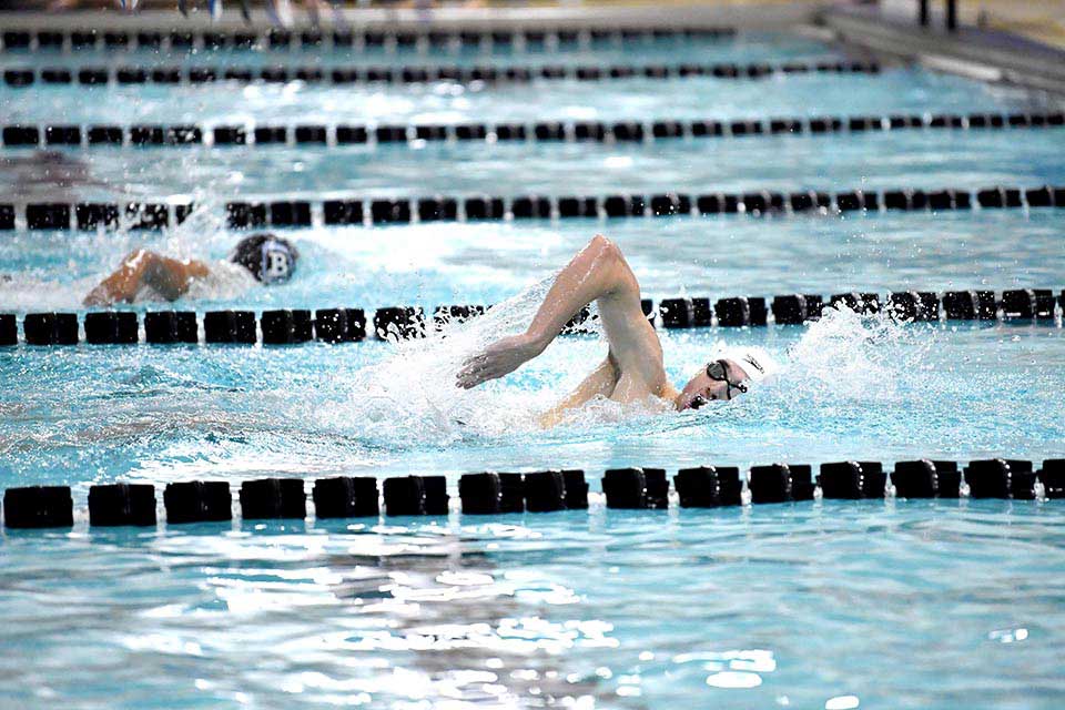 A person swimming in a pool