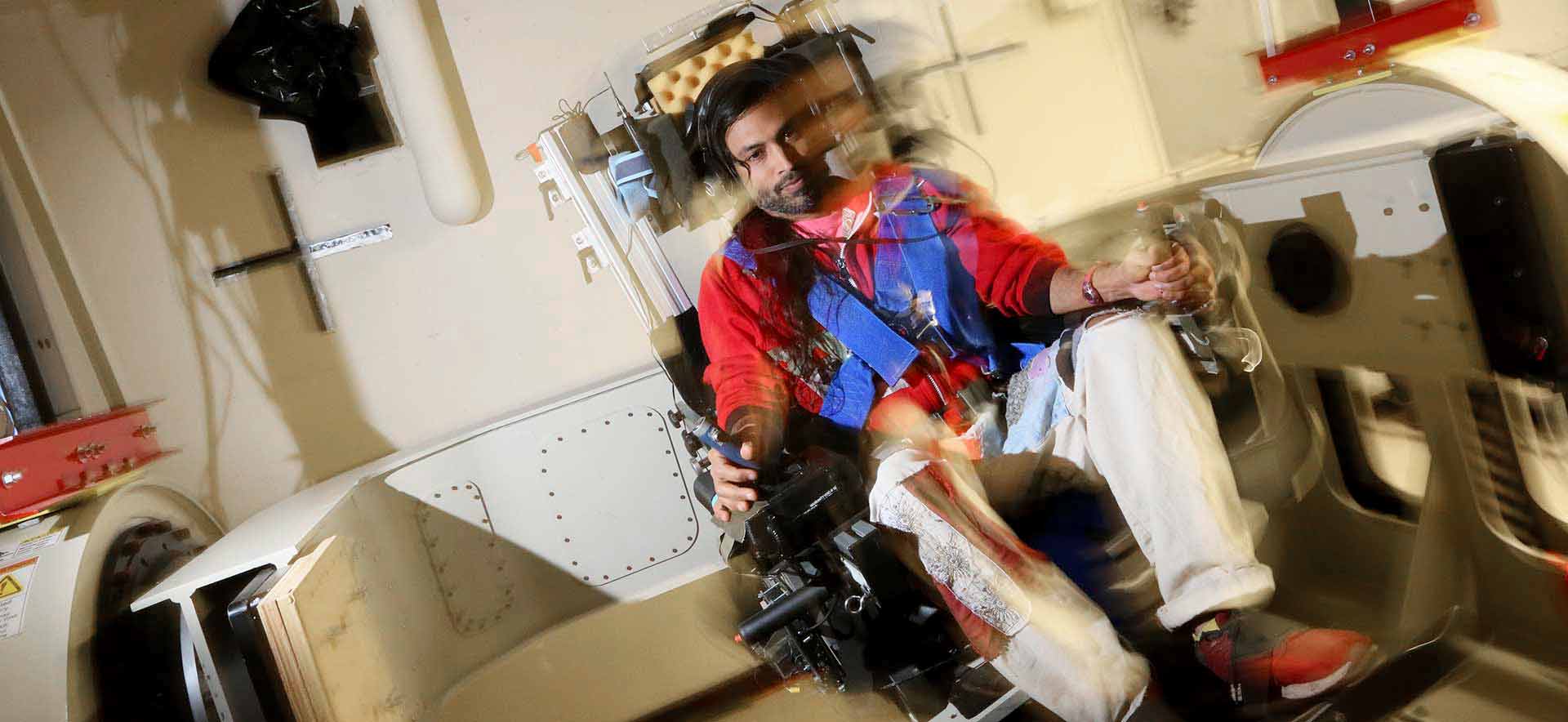 Vivek Vimal in a rotational chair in the Graybiel Laboratory