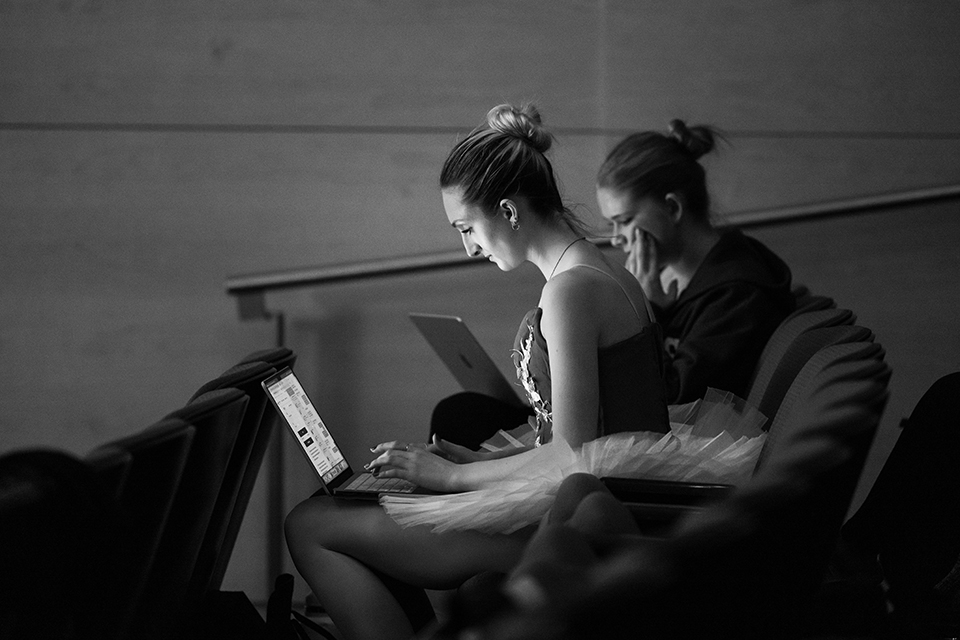 students sit with laptops