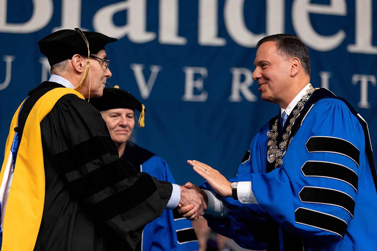 Drew Weissman is given an honorary degree from Brandeis University President Ron Liebowitz