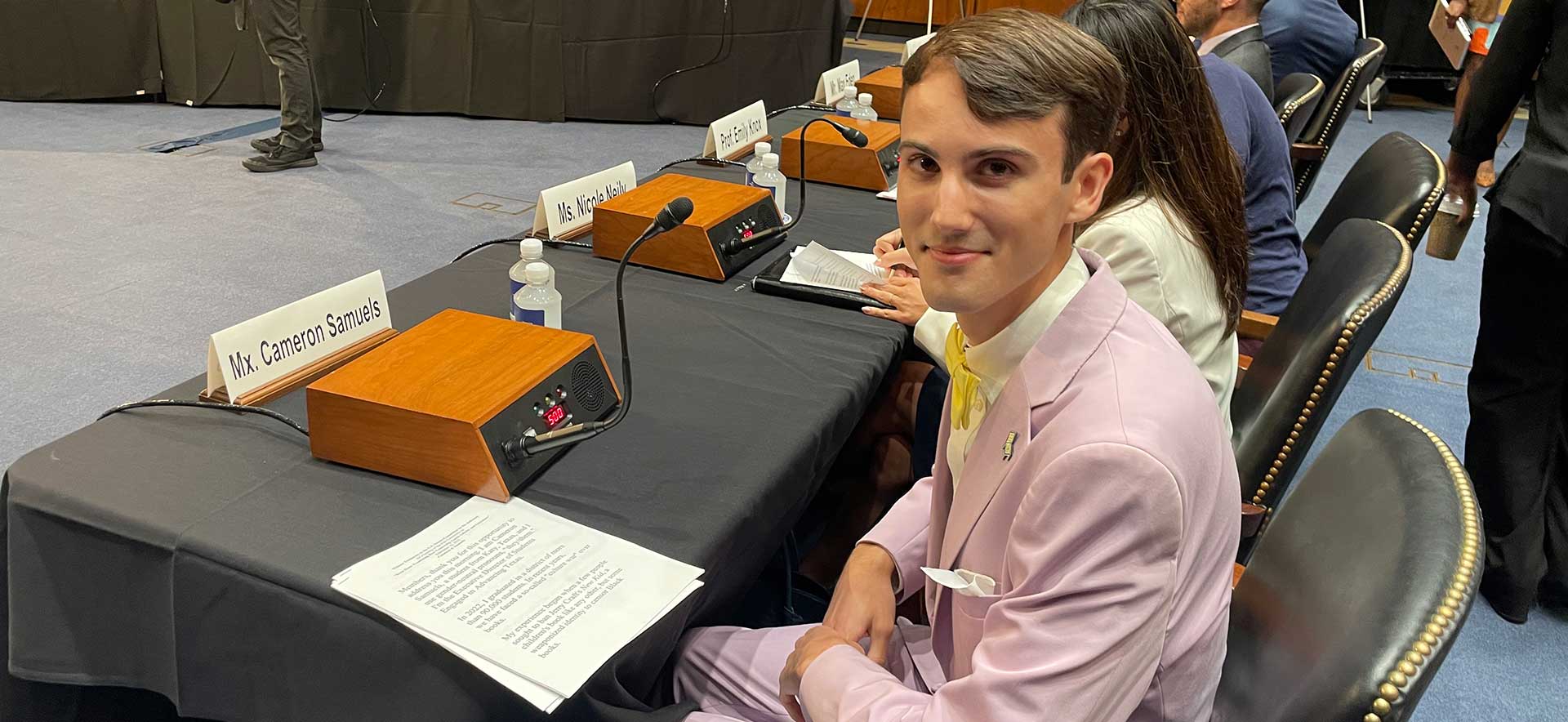 Cameron Samuels sits at a table ready to testify before the Senate