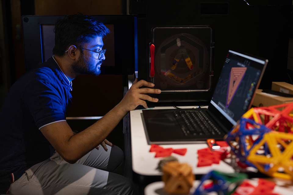 Rupam Saha works at a computer the Physics lab