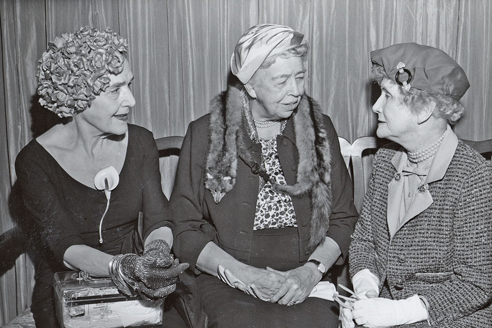 Eleanor Roosevelt speaks with two women, one of which is Fannie Hurst