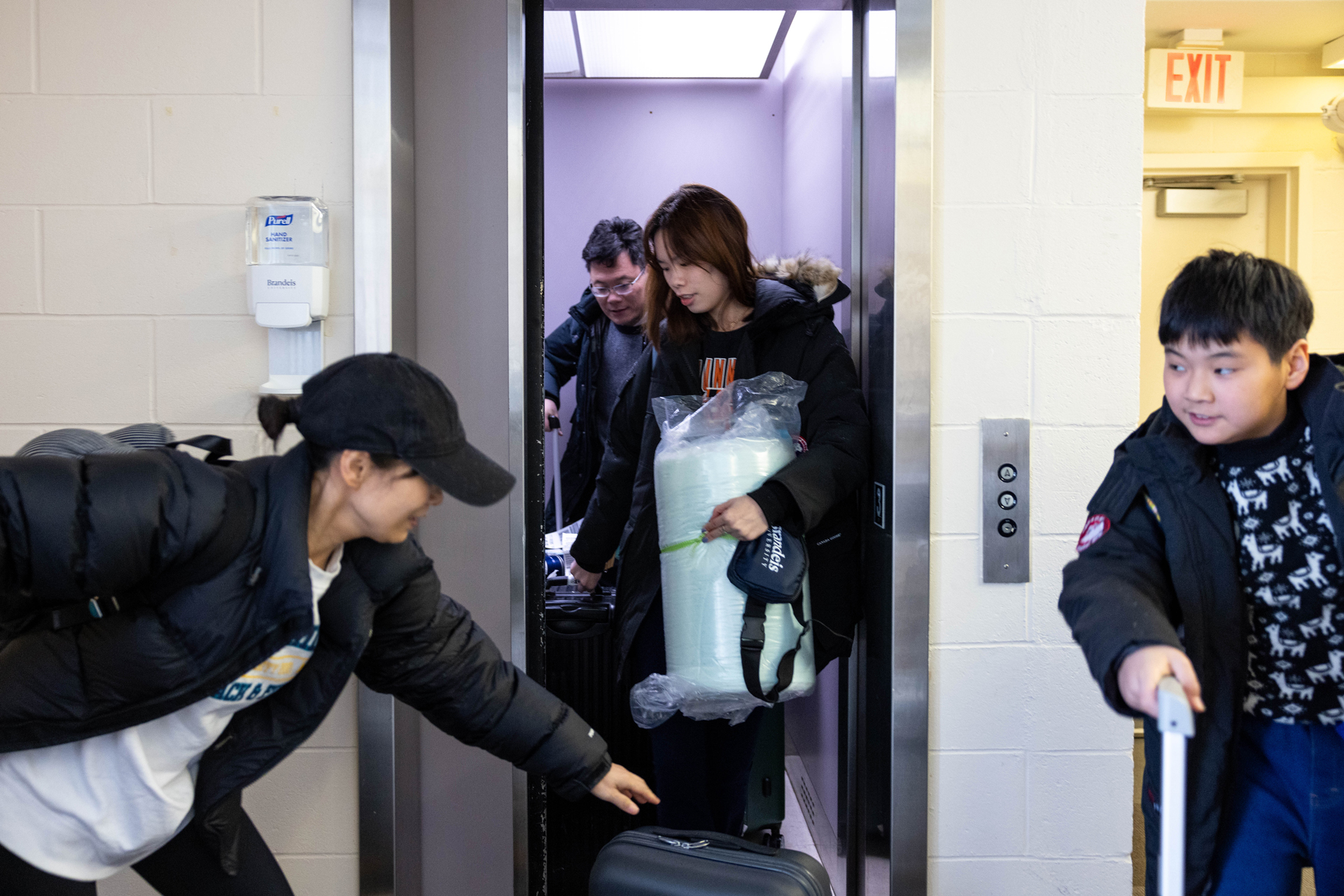 Student and family getting in elevator