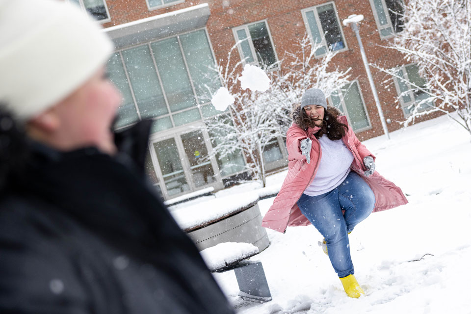 Students have a snowball fight