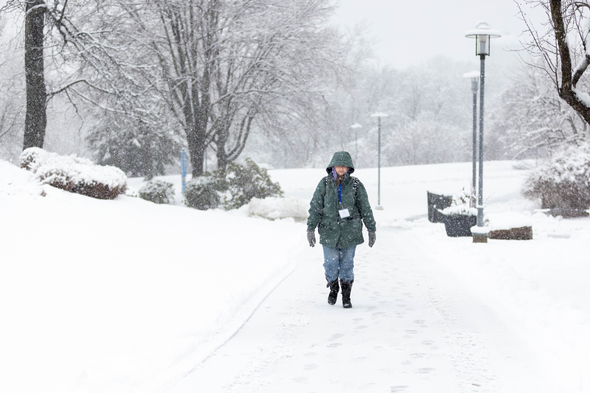 Student walking through snowstorm