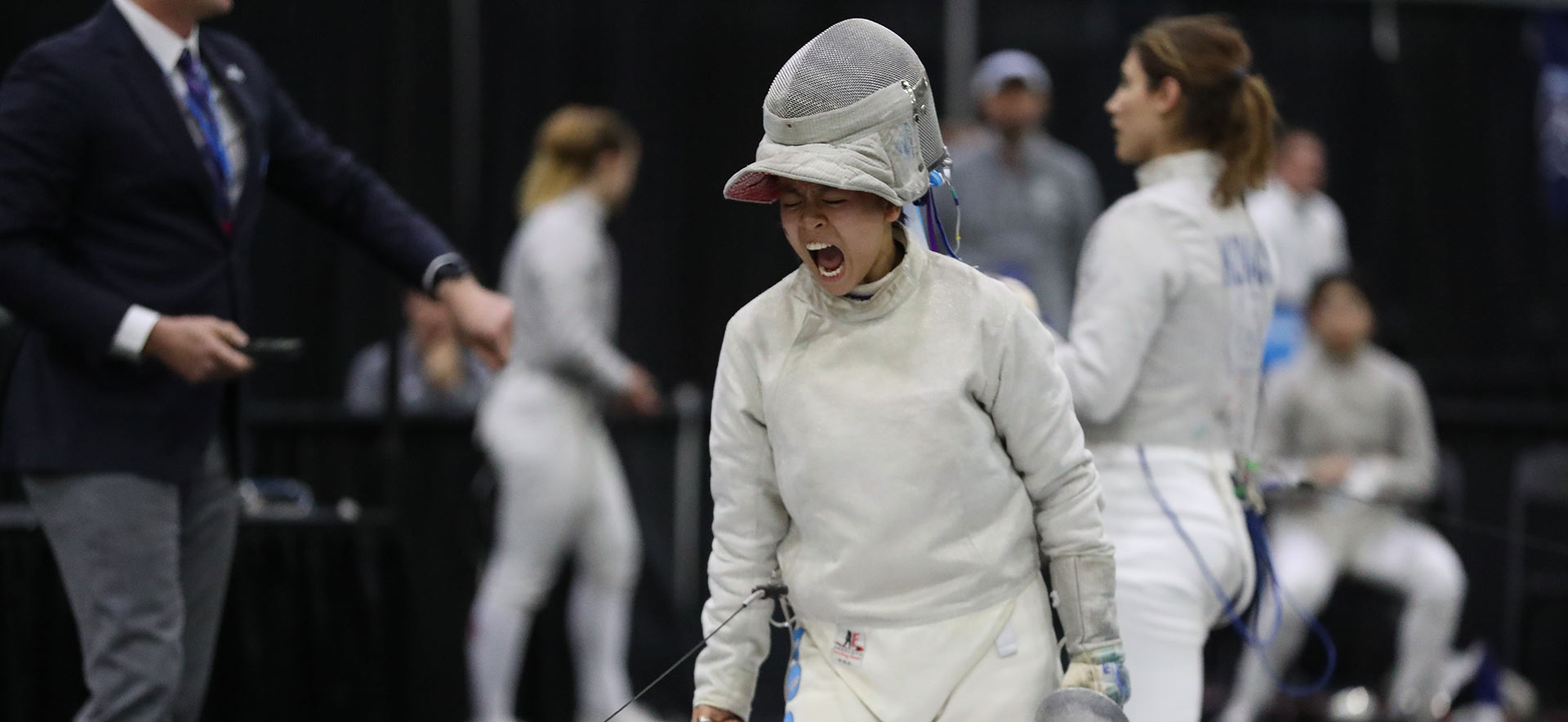 Maggie dressed in her fencing uniform. Photo Credit: Ricky Bassman