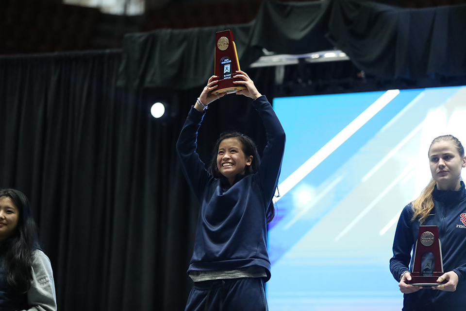 maggie holds trophy